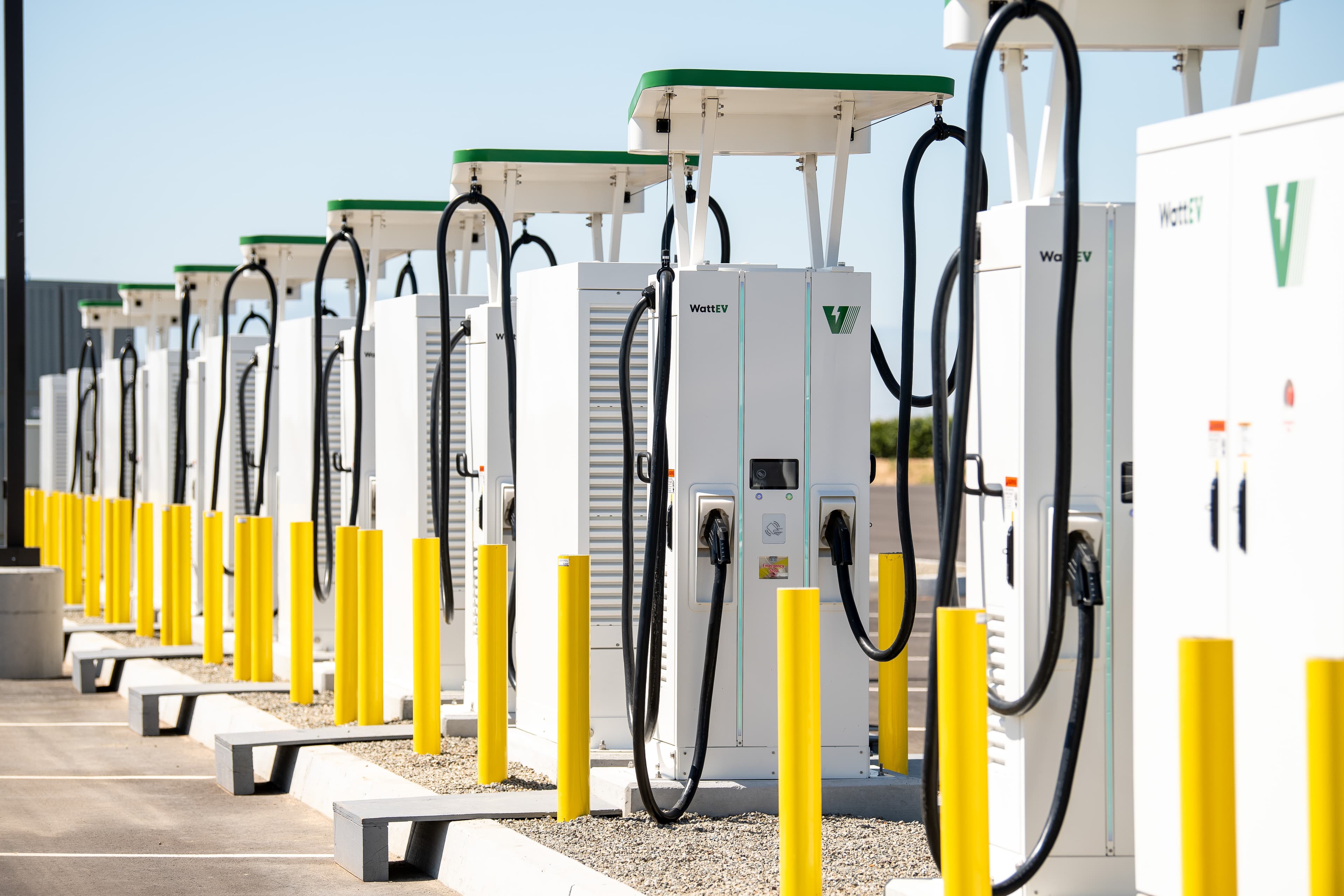 Row of high-power chargers at a WattEV depot
